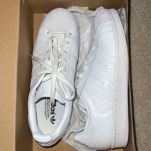 All white sneak skin imprint adidas. NWT.